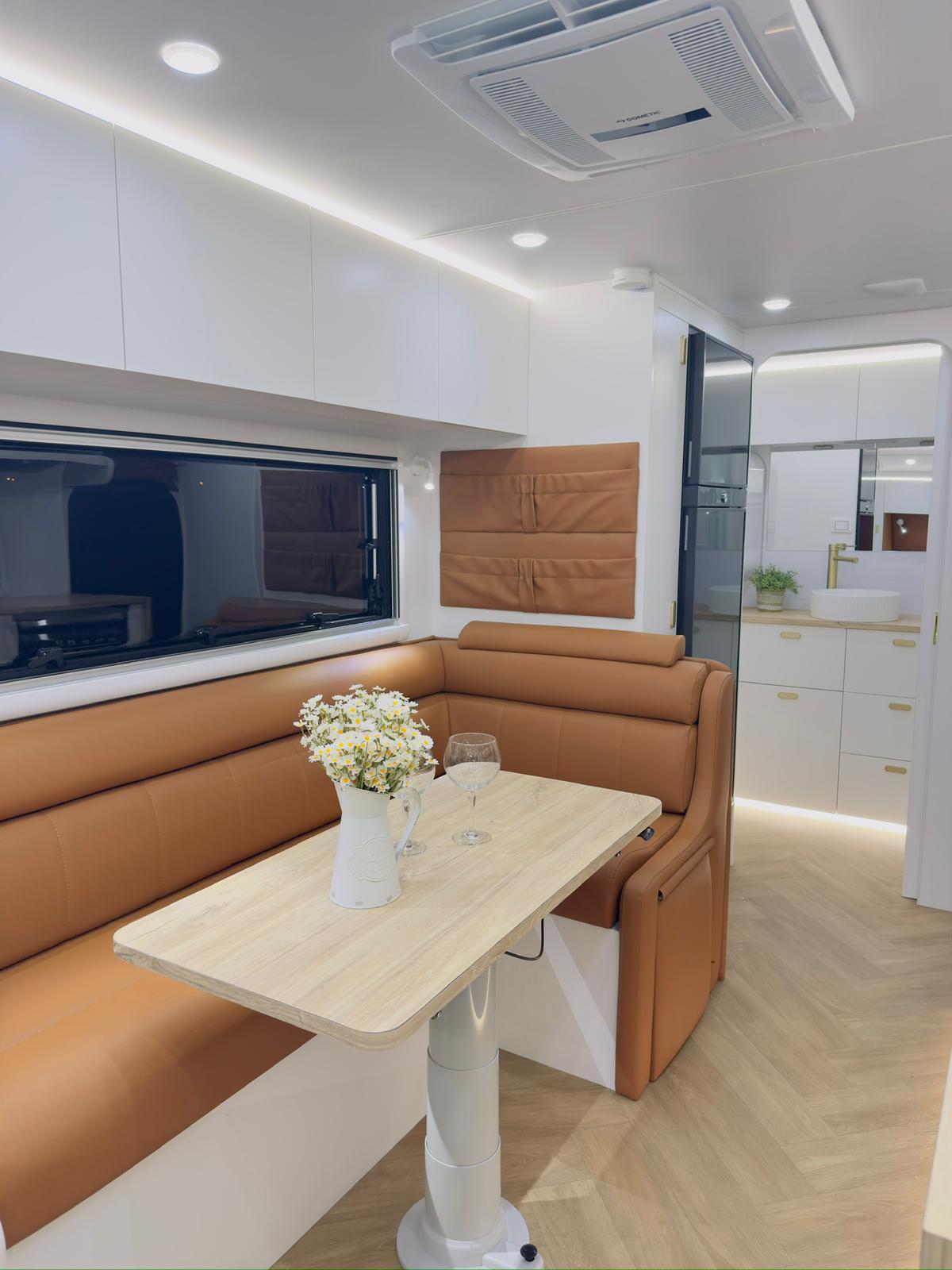 Caravan dinette with tan leather seating